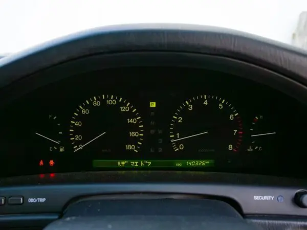 Car dashboard with speedometer and gauges.