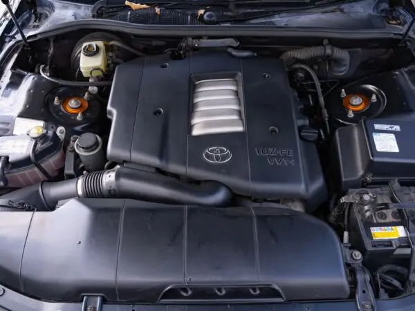 Black Toyota 1UZ-FE VVT-i engine bay.