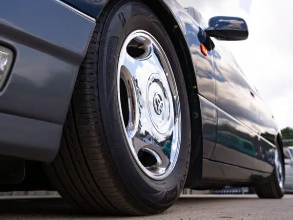 Closeup of a car tire and wheel.