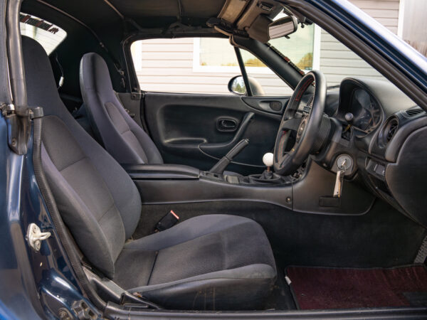 Black interior of a convertible car.