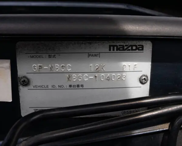 Mazda vehicle identification plate.