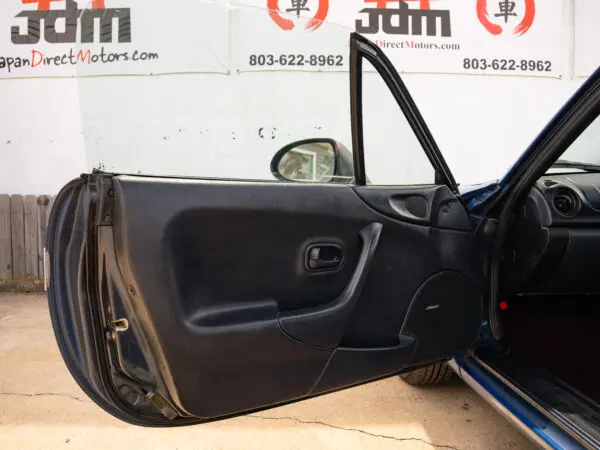 Open car door with black interior.