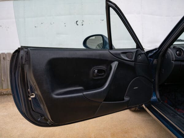 Open car door with black interior.