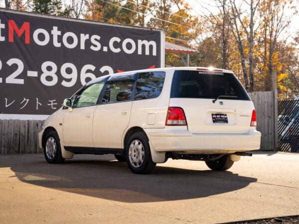 White Honda Odyssey minivan for sale.