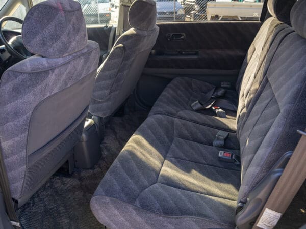 Gray car interior, back seats.