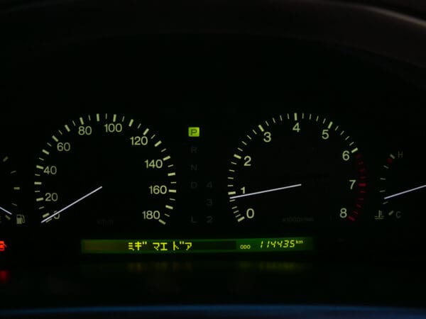 Car dashboard with speedometer and odometer.