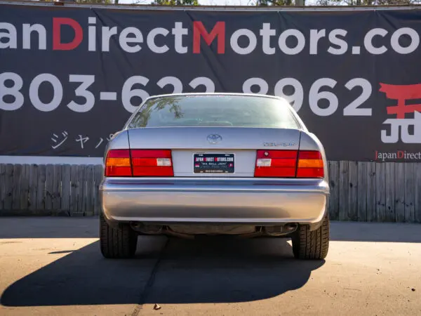 Silver Lexus LS400 rear view.