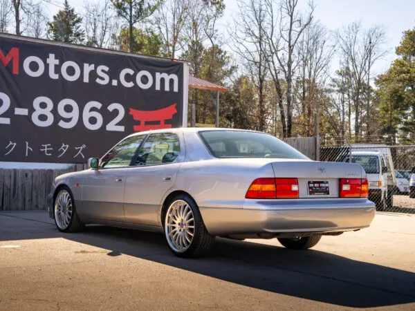 Silver Lexus Celsior, rear view.