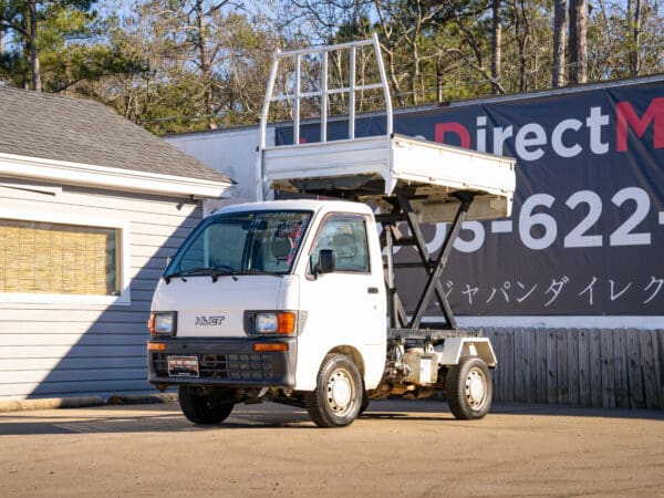 White mini dump truck for sale.