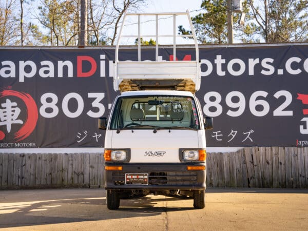 White Hijet truck with cargo rack.