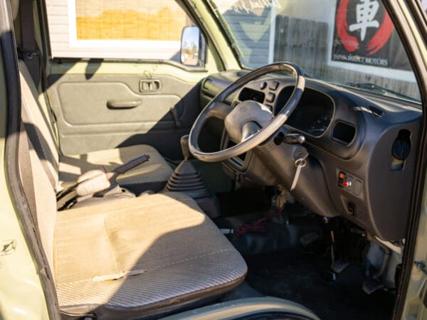 Light green mini truck interior.