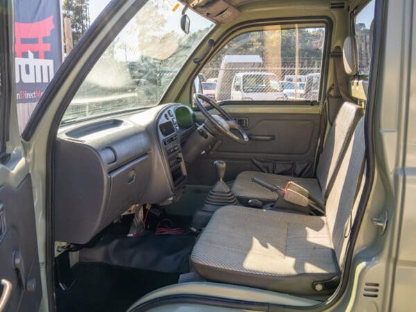 Light green mini truck interior view.